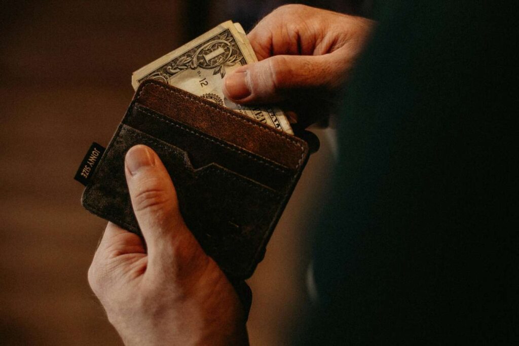 Person taking out money from a wallet