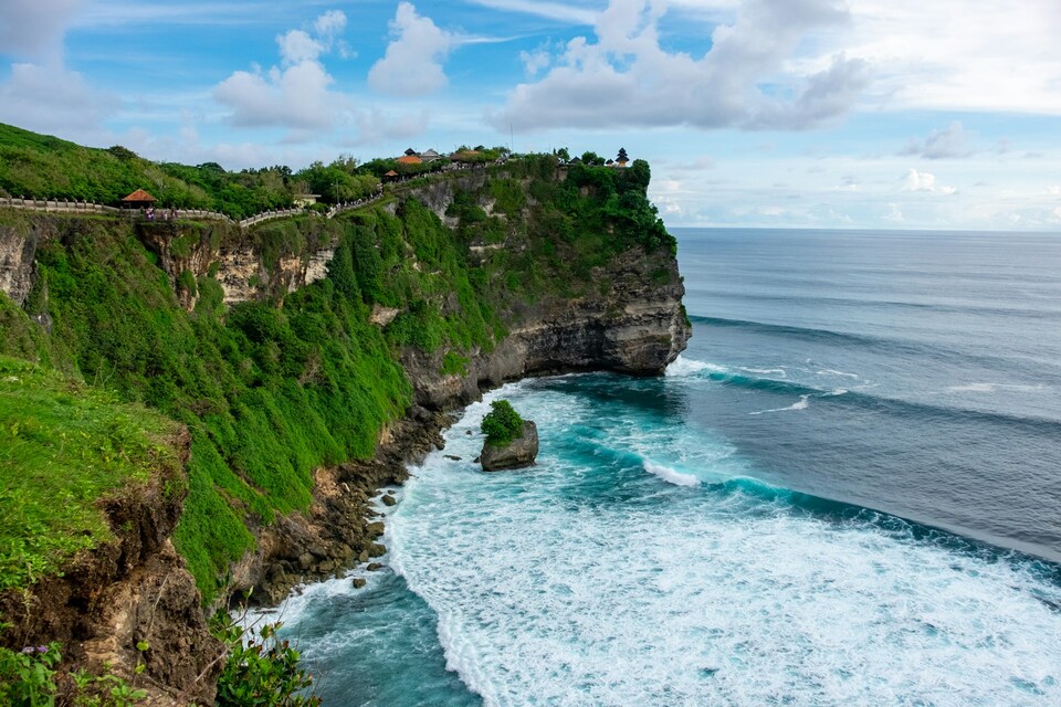 A cliff with ocean below 