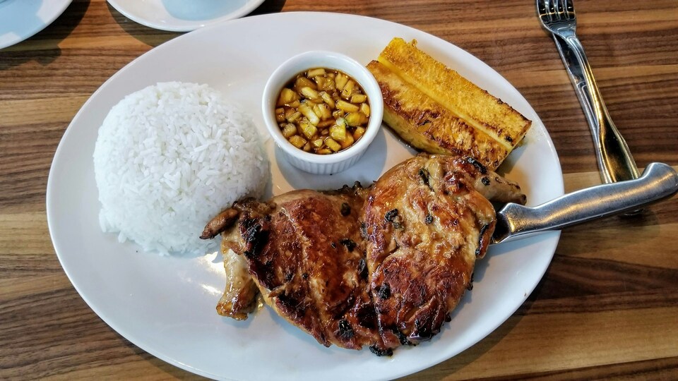 A plate of grilled meat, grilled fruit, and steamed rice